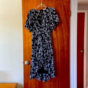 Black high low, wrap dress with white flower pattern